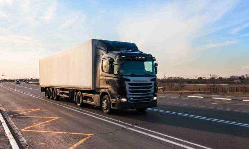 black-truck-moving-city-s-suburb